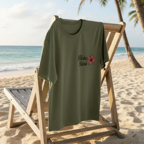 AlohaNene Hibiscus shirt laying on Hawaiian chair on beach