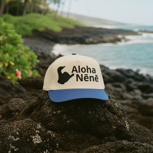 Cap with 'Aloha Nèné' text on a rock with ocean view Hawaii